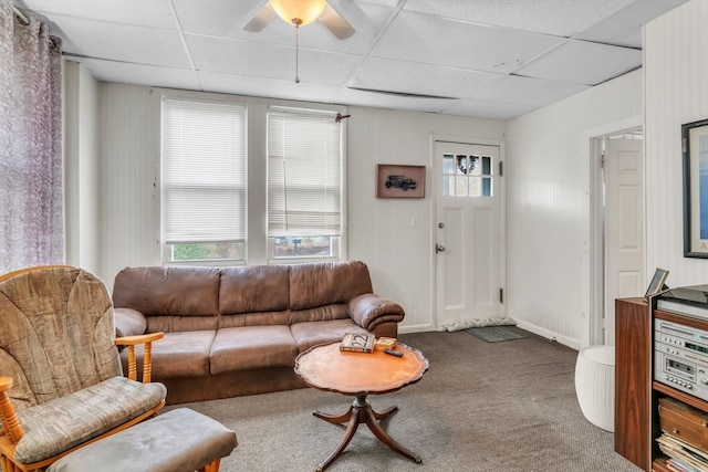 carpeted living room featuring a paneled ceiling and ceiling fan