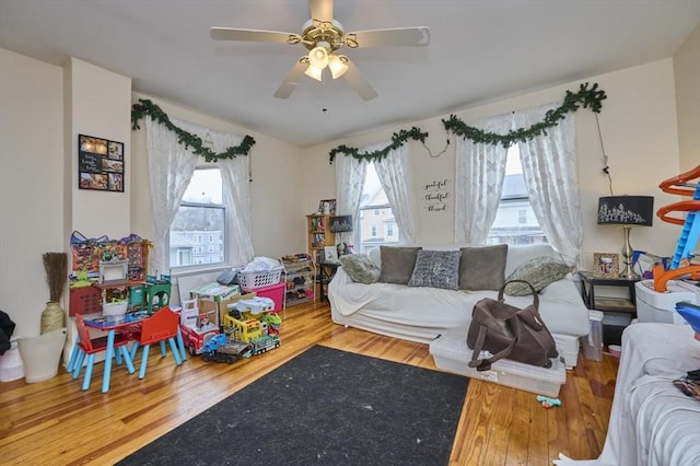living room featuring wood finished floors and ceiling fan