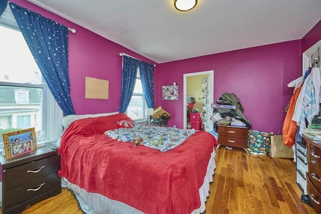 bedroom featuring wood finished floors