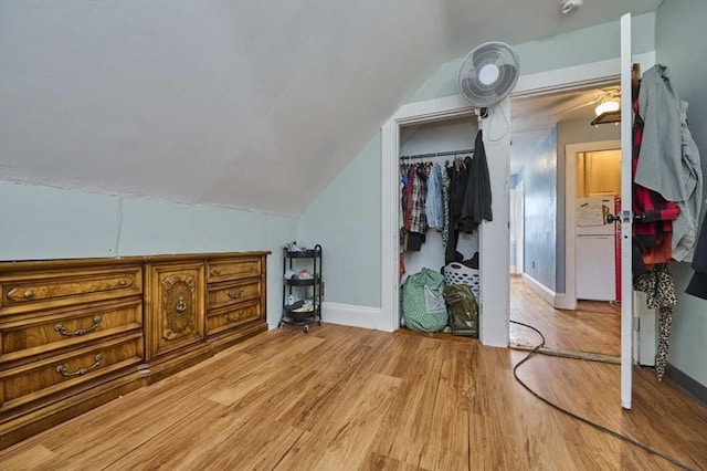 bonus room featuring baseboards, lofted ceiling, and light wood-type flooring