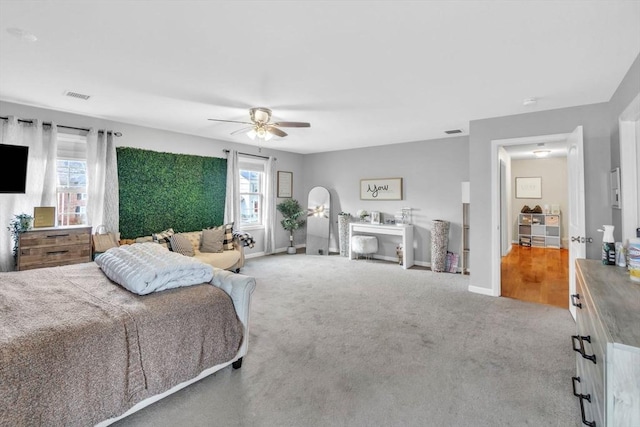 carpeted bedroom featuring ceiling fan