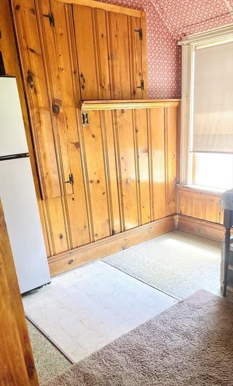 1123 S Broadway, East Providence, RI 02914 - interior space with freestanding refrigerator, wallpapered walls, a wainscoted wall, and tile patterned floors