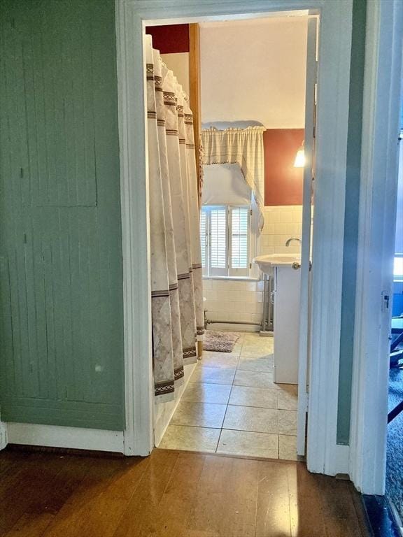 1123 S Broadway, East Providence, RI 02914 - hall featuring tile walls, wainscoting, and tile patterned flooring