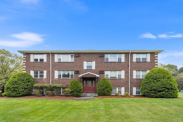 118 Parker St Unit 16, Acton, MA 01720 - view of front facade featuring a front yard and brick siding