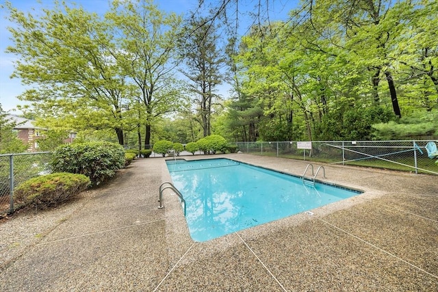 118 Parker St Unit 16, Acton, MA 01720 - view of swimming pool featuring fence and a patio