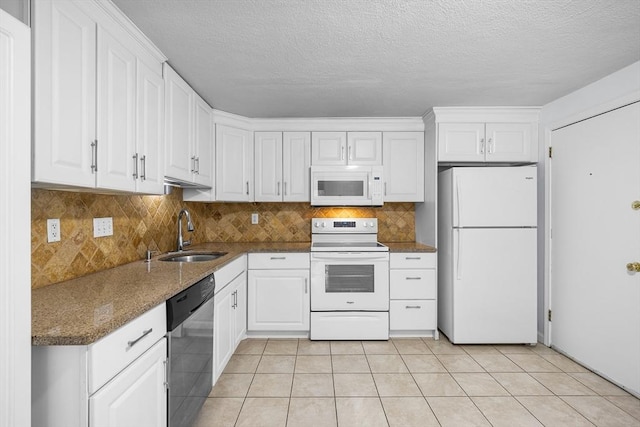 118 Parker St Unit 16, Acton, MA 01720 - kitchen featuring white appliances, a sink, white cabinetry, backsplash, and a textured ceiling