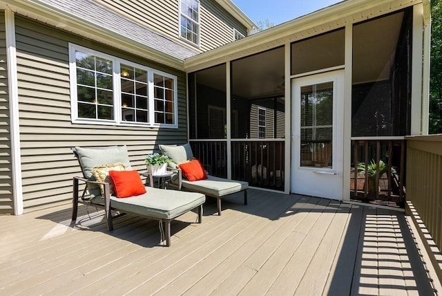 wooden terrace featuring a sunroom