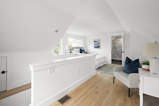 17 Bow Street Pl Unit 2, Somerville, MA 02143 - bedroom with vaulted ceiling, light wood-style floors, and baseboards