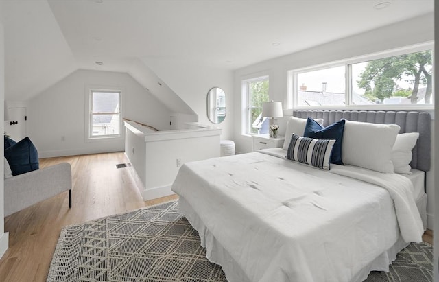 17 Bow Street Pl Unit 2, Somerville, MA 02143 - bedroom with multiple windows, light wood-style floors, and lofted ceiling