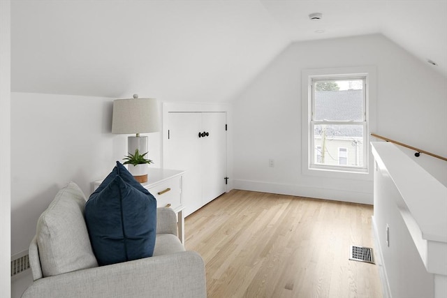 17 Bow Street Pl Unit 2, Somerville, MA 02143 - additional living space featuring light wood finished floors, vaulted ceiling, and baseboards