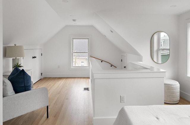 17 Bow Street Pl Unit 2, Somerville, MA 02143 - bedroom with light wood finished floors, baseboards, and vaulted ceiling