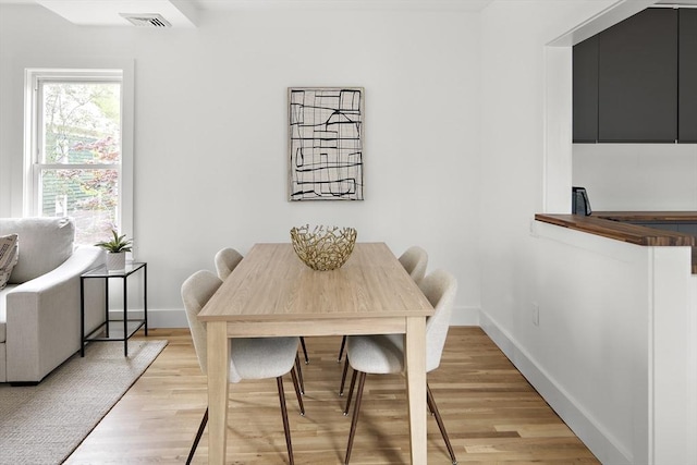 17 Bow Street Pl Unit 2, Somerville, MA 02143 - dining area with baseboards and light wood-style flooring