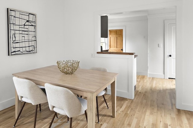 17 Bow Street Pl Unit 2, Somerville, MA 02143 - dining area with baseboards and light wood finished floors