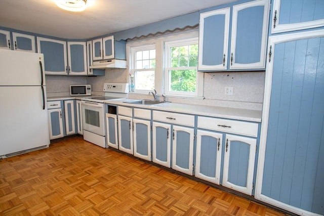 42 Giasson St, Hudson, MA 01749 - kitchen with white appliances, a sink, under cabinet range hood, light countertops, and decorative backsplash