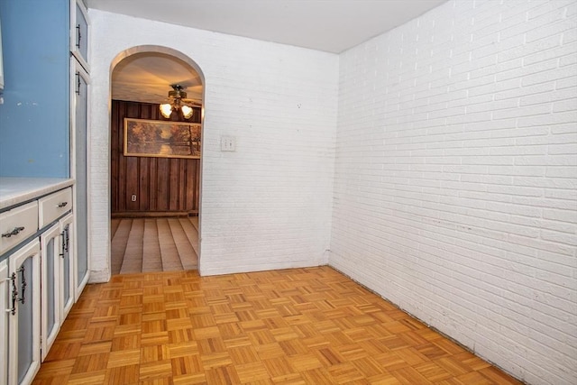 42 Giasson St, Hudson, MA 01749 - unfurnished room featuring brick wall, ceiling fan, and arched walkways
