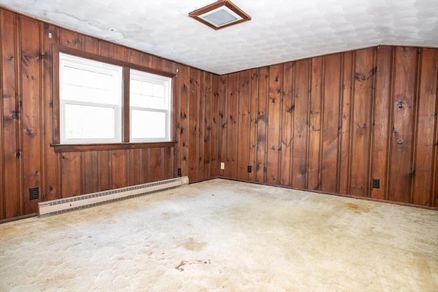 42 Giasson St, Hudson, MA 01749 - spare room featuring a baseboard radiator, wood walls, and carpet