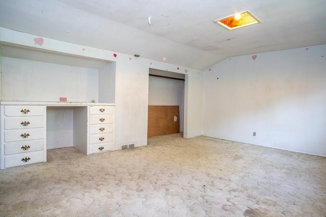 42 Giasson St, Hudson, MA 01749 - empty room featuring lofted ceiling, light colored carpet, and an office area