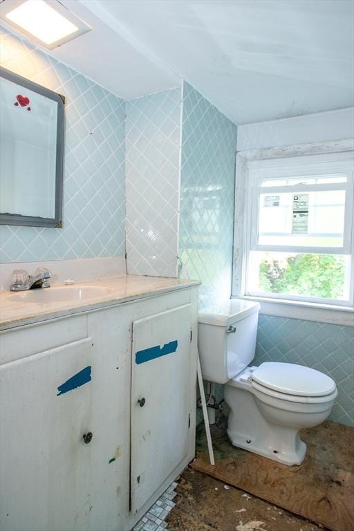 42 Giasson St, Hudson, MA 01749 - bathroom with tile walls, toilet, and vanity