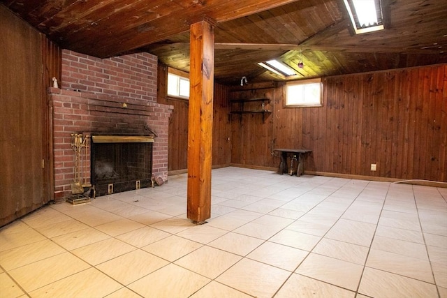 42 Giasson St, Hudson, MA 01749 - basement with wood ceiling, wood walls, and a fireplace