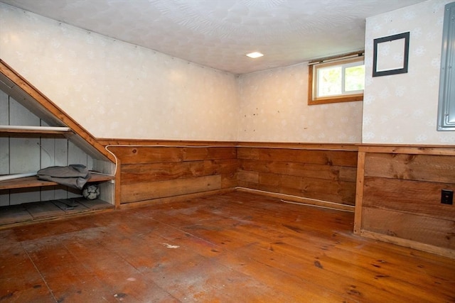 42 Giasson St, Hudson, MA 01749 - below grade area with hardwood / wood-style flooring and wooden walls