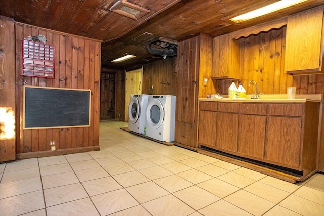 42 Giasson St, Hudson, MA 01749 - laundry area with washing machine and dryer, wood ceiling, wooden walls, and light floors