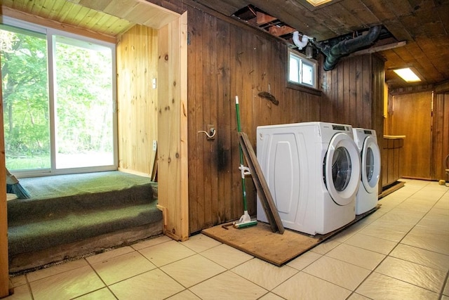 42 Giasson St, Hudson, MA 01749 - washroom with washer and clothes dryer, wooden walls, and light tile patterned flooring