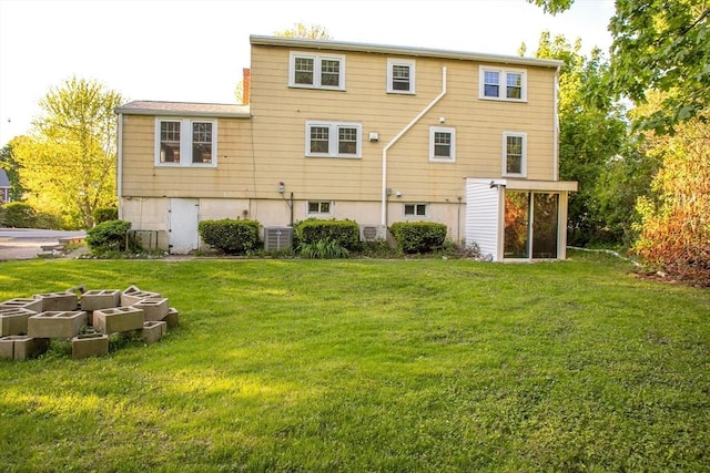 42 Giasson St, Hudson, MA 01749 - back of house featuring a lawn and cooling unit