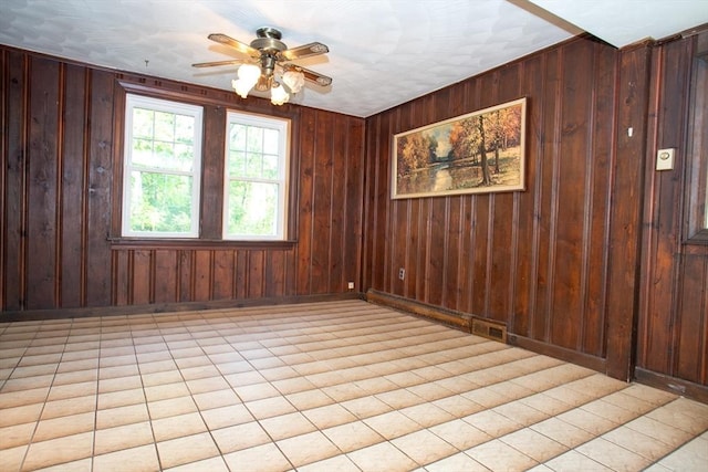 42 Giasson St, Hudson, MA 01749 - empty room with a ceiling fan, baseboards, and wood walls