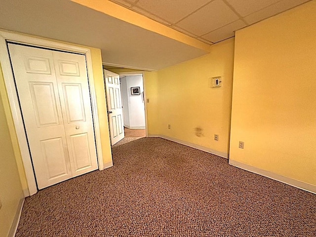 carpeted empty room with baseboards