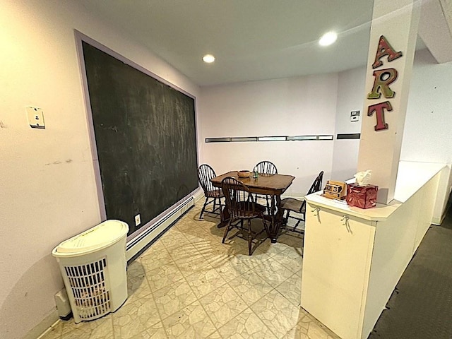 dining room with baseboard heating and recessed lighting