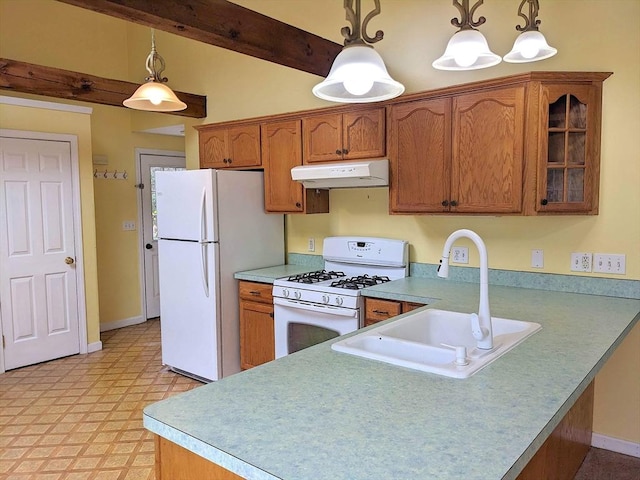kitchen with white appliances, under cabinet range hood, brown cabinetry, and a sink