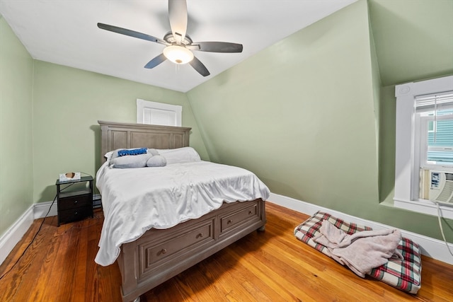 bedroom with wood-type flooring and ceiling fan