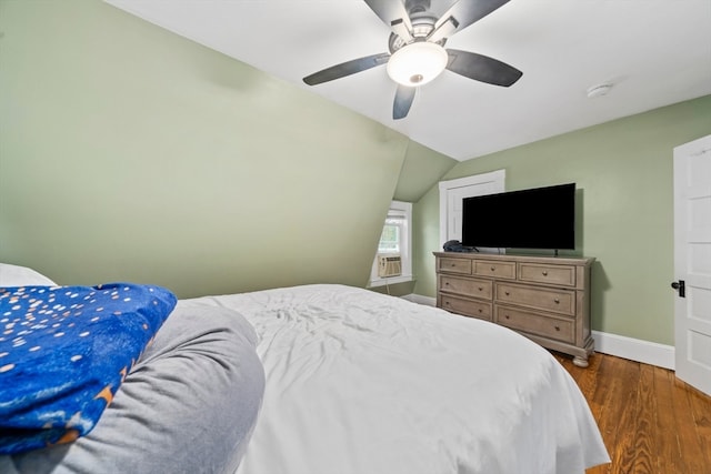 bedroom featuring vaulted ceiling, ceiling fan, and dark hardwood / wood-style floors