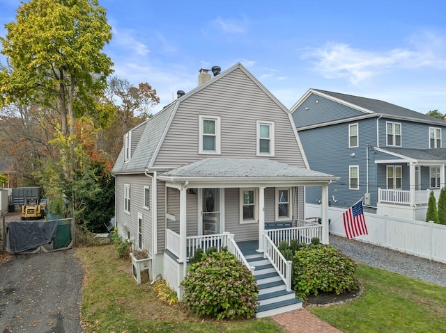 view of front of property featuring covered porch