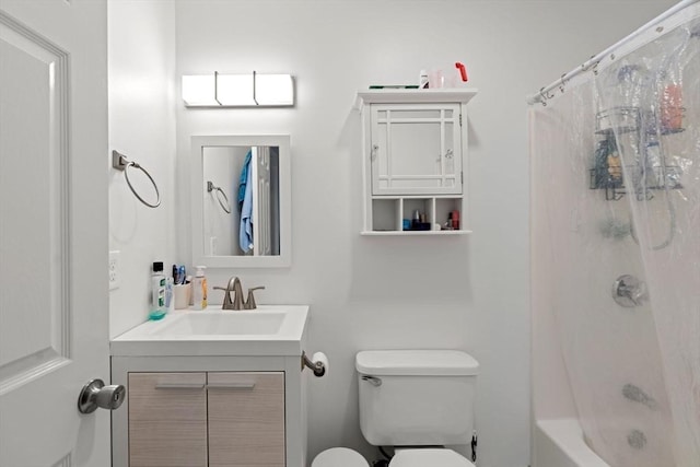 bathroom with toilet and vanity