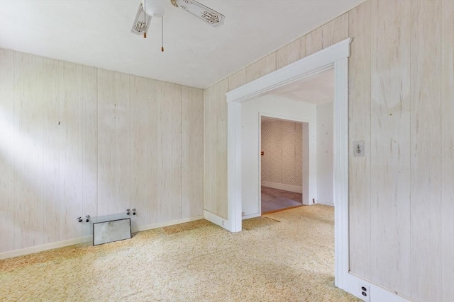 34 Worcester St, Grafton, MA 01519 - carpeted spare room with wooden walls and a ceiling fan