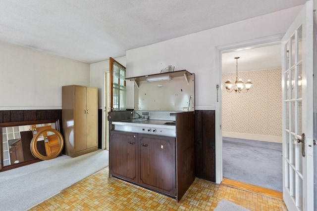 34 Worcester St, Grafton, MA 01519 - kitchen featuring stainless steel counters, a chandelier, dark brown cabinets, and a textured ceiling