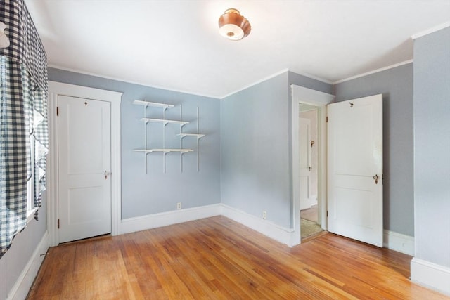 34 Worcester St, Grafton, MA 01519 - unfurnished bedroom with wood finished floors, baseboards, crown molding, and a closet