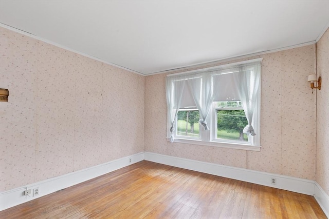 34 Worcester St, Grafton, MA 01519 - unfurnished room featuring light wood-type flooring, wallpapered walls, baseboards, and ornamental molding