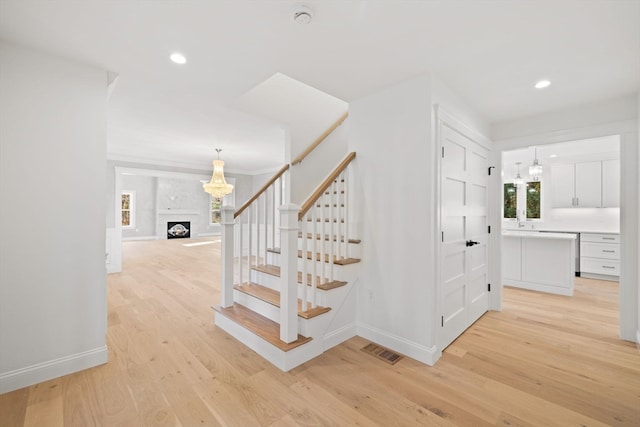 staircase featuring hardwood / wood-style floors