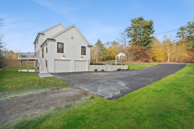 view of property exterior with a yard, a garage, and a deck