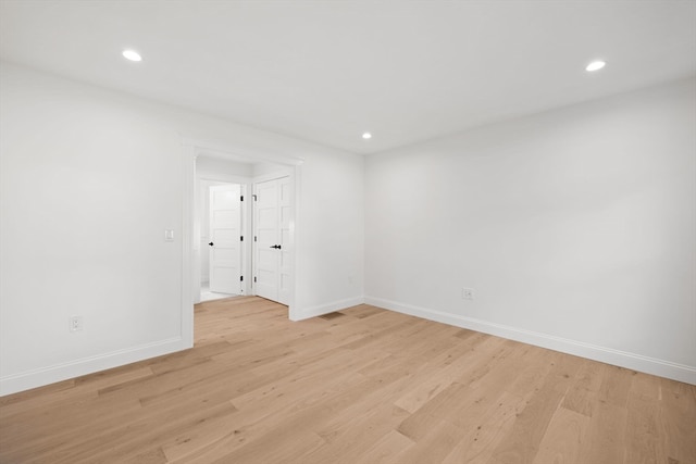 unfurnished room featuring light wood-type flooring