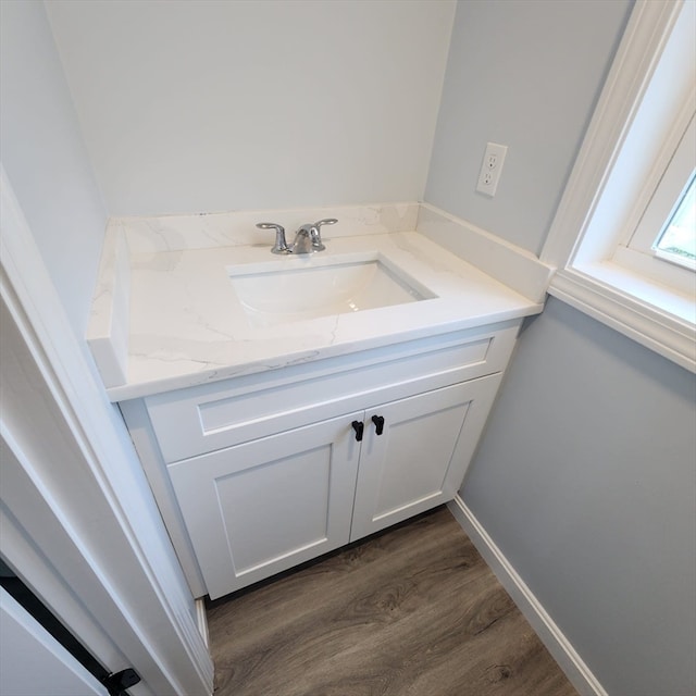 bathroom featuring hardwood / wood-style floors and vanity