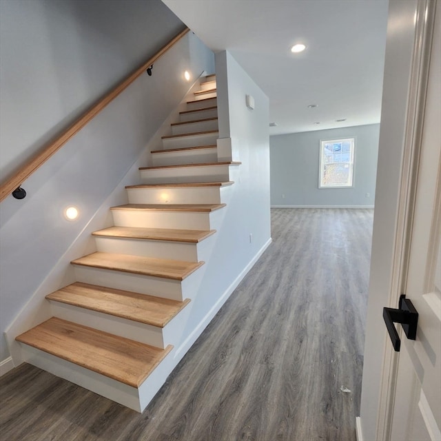 stairway featuring wood-type flooring