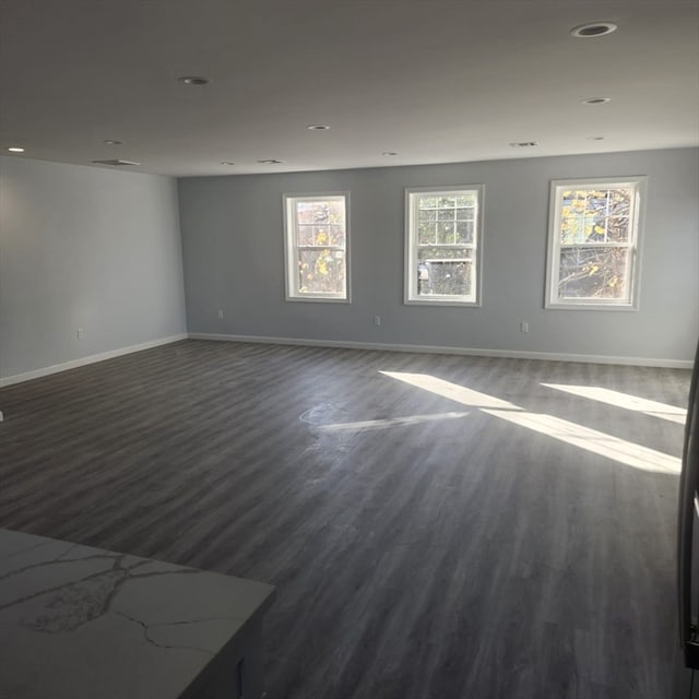 spare room with wood-type flooring