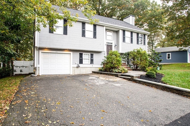 raised ranch featuring a garage