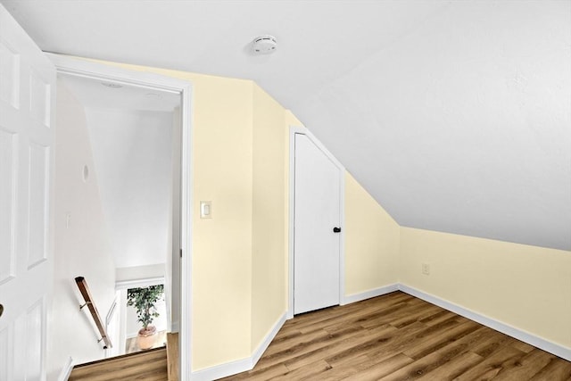 216 Waltham St, Hanson, MA 02341 - bonus room with wood finished floors, baseboards, and lofted ceiling