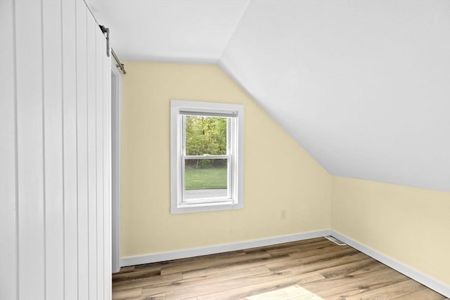 216 Waltham St, Hanson, MA 02341 - additional living space featuring vaulted ceiling, wood finished floors, and baseboards