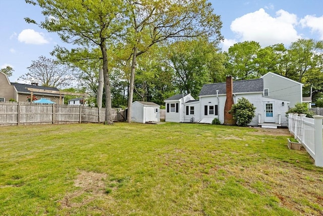 216 Waltham St, Hanson, MA 02341 - view of yard with a storage unit, entry steps, and an outbuilding
