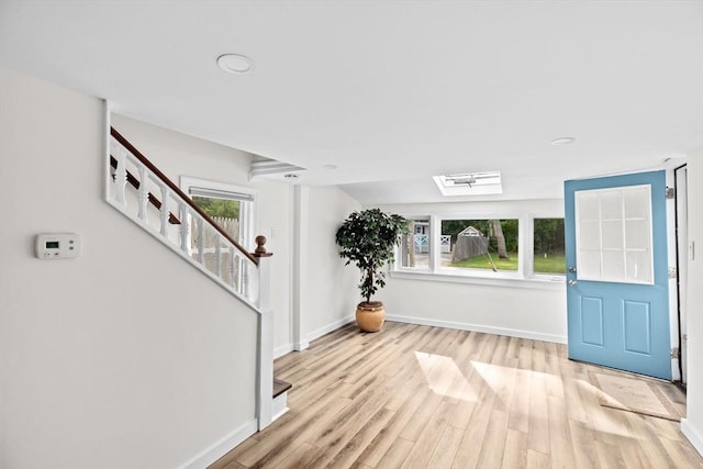 216 Waltham St, Hanson, MA 02341 - foyer entrance with light wood-style floors, baseboards, stairway, and recessed lighting